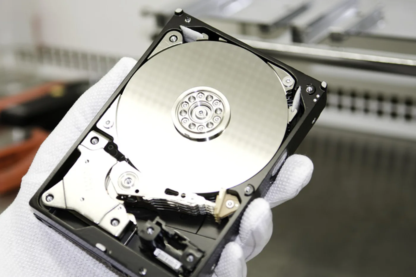 External hard drive used as a backup copy next to a laptop